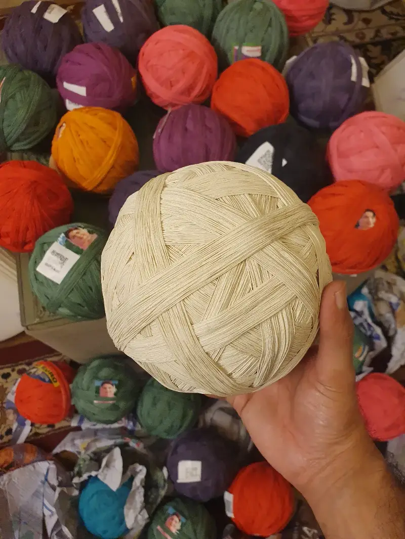 2 PC pinna of natural white cotton dor held in hand