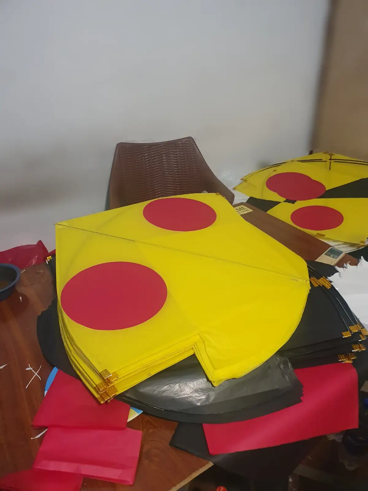 Stack of finished gudda kites in the workshop